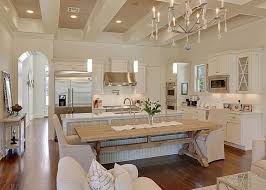 The wood floors, pendant lights, countertops and rooster artwork contribute to that feeling throughout the space. Pin By Savvy Southern Style French On Kitchens Home House Design Beautiful Kitchens
