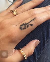 Placement Of The Rose On Point But I D Have It Face If Me Finger Tattoos Tattoos Hand Tattoos