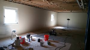 Basement walls of cinder block, brick, or even poured concrete can be transformed pretty quickly and simply with a coat of paint. Dressing Up The Basement Steel Beam And Concrete Walls Kimchi Kraut