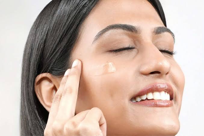 Skincare serum and moisturising products arranged for a niacinamide skincare routine