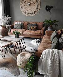 Living room with brown couch and glass chandelier. Ideas For Wall Colors That Go With Brown Furniture The Inside
