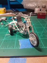 Just opened my latest care package from Stacey Cheeks! He willingly let me  buy this little gem!!! Built with the Revell BSA engine and front half of  the frame, Revell Harley front