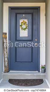 You can open up the energy by directing the eye to the. Vertical Blue Front Door Of A Home Decorated With Wreath Welcome Sign And Potted Flower Close Up Of The Entrance Of A House Canstock