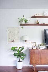 Additional white floating shelves create extra storage space. 40 Ideas For Decorating Around The Tv A House Full Of Sunshine