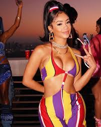 We rounded up a few of our favorite looks here. Saweetie Celebrates Her Birthday In Custom Karl Kani Yellow Red And Purple Two Piece Bikini Top Jumpsuit By Khala Whitney Fashion Bomb Daily Style Magazine Celebrity Fashion Fashion News What To