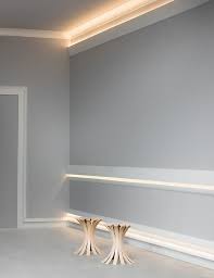 Chair rail wainscoting features a decorative wood treatment on the top of the panel that is reminiscent of a hand rail. Cool Application Of Calabasas Moldings As Chair Rail Above The Baseboard And As Cornice For Indirect Lightin Diy Crown Molding House Ceiling Design Orac Decor