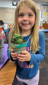 Preschoolers plant succulents in class activity