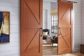 While barn doors are characteristically country, they've become a trendy mainstay in farmhouses and modern homes alike. Barn Doors Specialty Doors Trustile Doors
