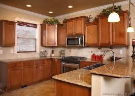 Pin By Kelly Leonard On Kitchen Medium Wood Kitchen Cabinets Brown Kitchen Cabinets Kitchen Cabinet Color Schemes