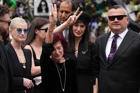 See how Ozzy Osbourne's wife Sharon and their children paid subtle tribute  to his iconic style during today's funeral procession:  https://theshaderoom.com/ozzy-osbourne-wife-sharon-jack-kelly-aimee-kids -fans-funeral-procession-photos-birmingham-england ...