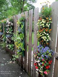 A garden fence is a practical way to keep critters away and gives structure to a yard or garden. Unexpected Garden Accents Our Fairfield Home Garden Decorative Garden Fencing Garden Fence Decoration Backyard Fences