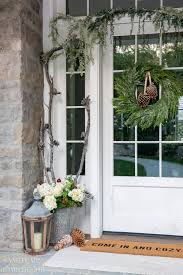 Neutral colors, natural elements, fresh greenery and red grain sack create a cozy space for the holiday season. Neutral Christmas Front Porch Decor Sanctuary Home Decor