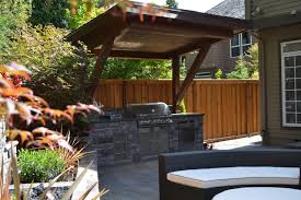 The wheels on the console are practical and enable the table to be moved easily. Outdoor Kitchen American Traditional Patio Portland By All Oregon Landscaping