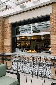 Your garage door panel is broken into sections. The Bar Opens Up To The Patio With A Custom Garage Door Opening Picture Of SÅw Plated Columbus Tripadvisor