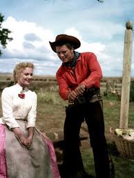 This joyous celebration of frontier life combines tender romance and violent passion in the oklahoma territory of the 1900s with a timeless score filled with unforgettable songs. Oklahoma Shirley Jones Gordon Macrae 1955 Photo Allposters Com In 2021 Shirley Jones Musical Movies Movie Stars