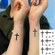The circle behind the cross symbolizes the sun and eternity. Water Transfer Fake Tattoo Small Cross Tatto Behind The Ear On Finger Waterproof Temporary Tatoo Stickers For Woman Man Small Cross Tattoo Tattoo Smallcross Tattoo Aliexpress