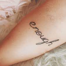 40 Minimalist One Word Tattoo Ideas That Are Beautiful On Every Woman Enough Tattoos For Women Enough Tattoos Tattoos For Women