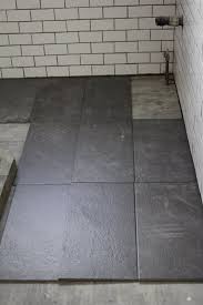 What S The Best Tile Layout For My Bathroom Straight Or Staggered Dark Tile Floors Tile Layout Floor Tile Design
