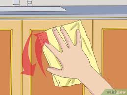Get some paper towels and an old credit card/store card or anything with a sturdy straight edge. 3 Ways To Clean Greasy Kitchen Cabinets Wikihow