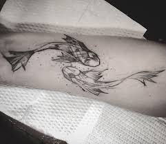 This piece uses an illustrative style to create a tattoo that feels almost like a gesture drawing. The True Meaning Of Koi Fish And Lotus Flower Tattoo 1984 Studio