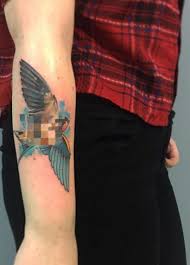A watercolor style bird is rendered in black and orange ink in this tattoo depicted on the wearer's ribcage. 90 Impressive Bird Tattoos That Will Help Your Concepts Take Flight