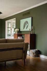 By limiting it to an entryway, you still get a pop of color without overwhelming your house. Forest Green Living Room Living Room Green Green Walls Living Room Living Room Designs