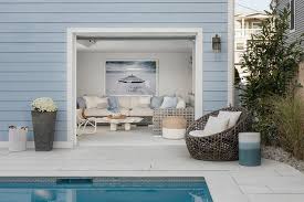 The white and gray wood look of this tile is fun and coastal, and perfect for a pool house space. Pool House Bathroom Design Ideas