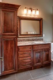 Dark cherry vanities are cooler in tone than vanities in natural cherry, so a warm or bright faucet will offset the vanity, while a dark faucet will coordinate with it. Bathroom Vanities Cherry Wood With Light Granite Make This Vanity Pop Bathroom Wall Colors Amazing Bathrooms Dark Wood Bathroom