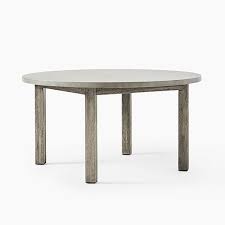 Modern small round wood and gray clay outdoor accent table with interior storage and rope handles. Concrete Outdoor Round Dining Table 60