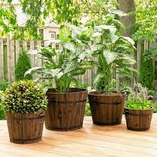 Use them to flank doorways, add natural beauty and color to your outdoor sitting area or add a splash of color to a restaurant or hotel's garden. Leisure Season Barrel Style Planters 4 Piece Wood Barrel Planter Set Reviews Wayfair