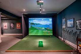 Traditional Man Cave With Home Golf Simulator Golf Simulators Buyer S Guide Carpet Flush Light Exposed Beam Golf Room Golf Simulators Home Golf Simulator