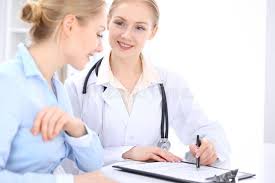 Blonde Female Doctor And Patient Talking In Hospital Office Health Care And Cli Affiliate Patient Talking Hospital Female Doctor Health Care Doctor