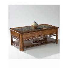 The adjustable height coffee table has a top that lifts up to working table height and adjusts back down you get a range of heights starting at 28 inches and ending at 42.5 inches. Magnussen Home Madison Warm Nutmeg Rectangular Lift Top Cocktail Table T1125 50 Bellacor