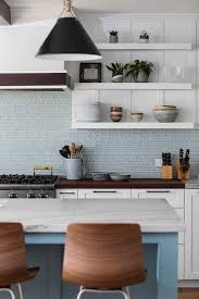 We supply and fit wall and floor tiles, including marble, granite, porcelain, mosaic etc Light Blue Glass Linear Kitchen Wall Tiles With Stacked Shelves Transitional Kitchen