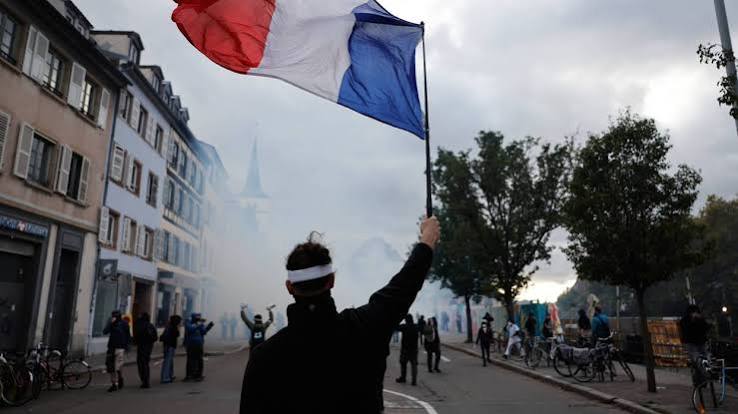 More than 400,000 protest across France, challenging Macron as Paris clashes erupt