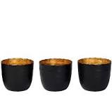 Black and gold metal candle holders. 15 30