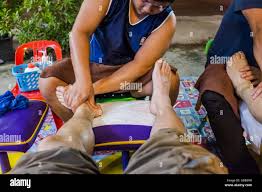 Man giving foot massage hi-res stock photography and images - Alamy