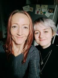 Hi I wondered if anybody could put a better background behind this picture  of my friehds and lose the mobile phone………thanks in advance