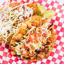 On the menu just once a week, her wild rock cod fish tacos are dunked in fat tire beer batter spiced with coriander and cayenne, fried to a crispy crunch and served up with chipotle lime sour cream, pico de gallo and lemon oil dressed. Baja Fish Taco Burgers Chula Vista Ca