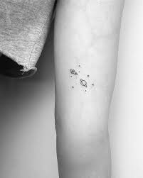 Astronomy Galaxy Tattoo Ideas Black And White Tiny Galaxy On The Left Inner Arm Simplistic Tattoos Planet Tattoos Astronomy Tattoo