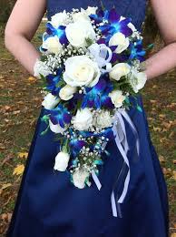 Use black ribbon to fix a few springs around a pin. San Antonio Blue Orchid Brides Bouquet By 1 Florist Wedding Florist