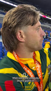 Notorious pitch invader stands arm-in-arm with Kangaroos during anthem:  https://shorturl.at/FVBfN