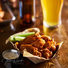 Pile Of Tasty Buffalo Chicken Wings In Paper Tray With Celery And Beer Ny Food Best Places To Eat Places To Eat