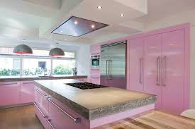 The backsplash, which doubles as a feature wall, is a mix of stained and painted reclaimed wood boards. Delicate Designs Creating A Beautiful Pastel Kitchen Better Housekeeper