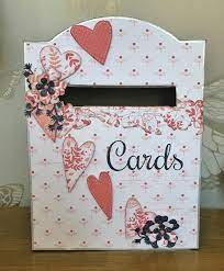 To make a wedding card box that houses guests' greeting cards, simply wrap a box in decorative wrapping paper and cut a slit in the top. Make Your Own Wedding Card Box Create Craft Blog