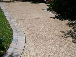 Aggregate concrete contains exposed rocks, consisting of a mixture of concrete, crushed stone, sand, and gravel. Exposed Aggregate Driveway With Paver Borders Aggregate Driveway Exposed Aggregate Driveway Resin Driveway