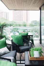 This Black And Green Covered Patio Features Black Wicker Chairs Accented With Dark Gray Seat Black Patio Furniture Gray Patio Furniture Black Outdoor Furniture