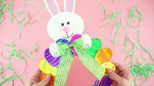 All you need is some colored patterned papers, cardboard step by step tutorial with pictures to make diy easter wreath. How To Make A Paper Plate Easter Egg Wreath Youtube