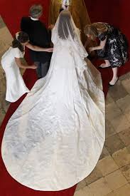 Guests filed out and walked to nearby englefield house, where it is believed a miss middleton wore a bespoke giles deacon dress, said to be crafted to create the impression of being seamless. 10 Things You Didn T Know About Kate Middleton S Wedding Dress Sarah Burton Designs The Royal Gown