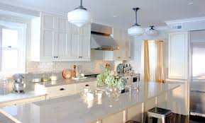 The house is 22 years old and we want to spruce it up, get rid of wall paper and perhaps use granite instead of the white lami. White Granite Countertops With White And Dark Cabinets Design Ideas